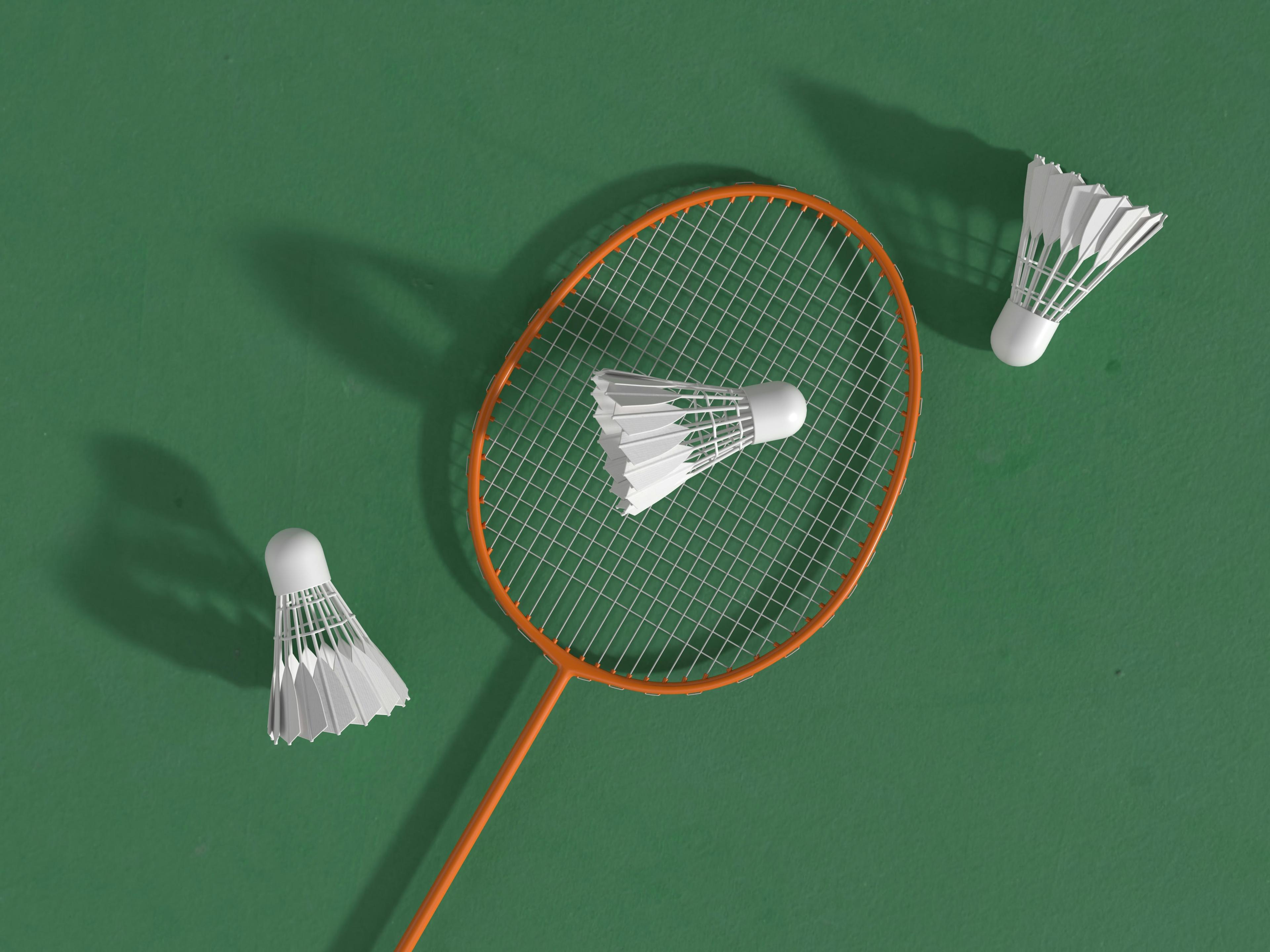 Badminton player leaping for a jump smash, representing competitive sports across disciplines